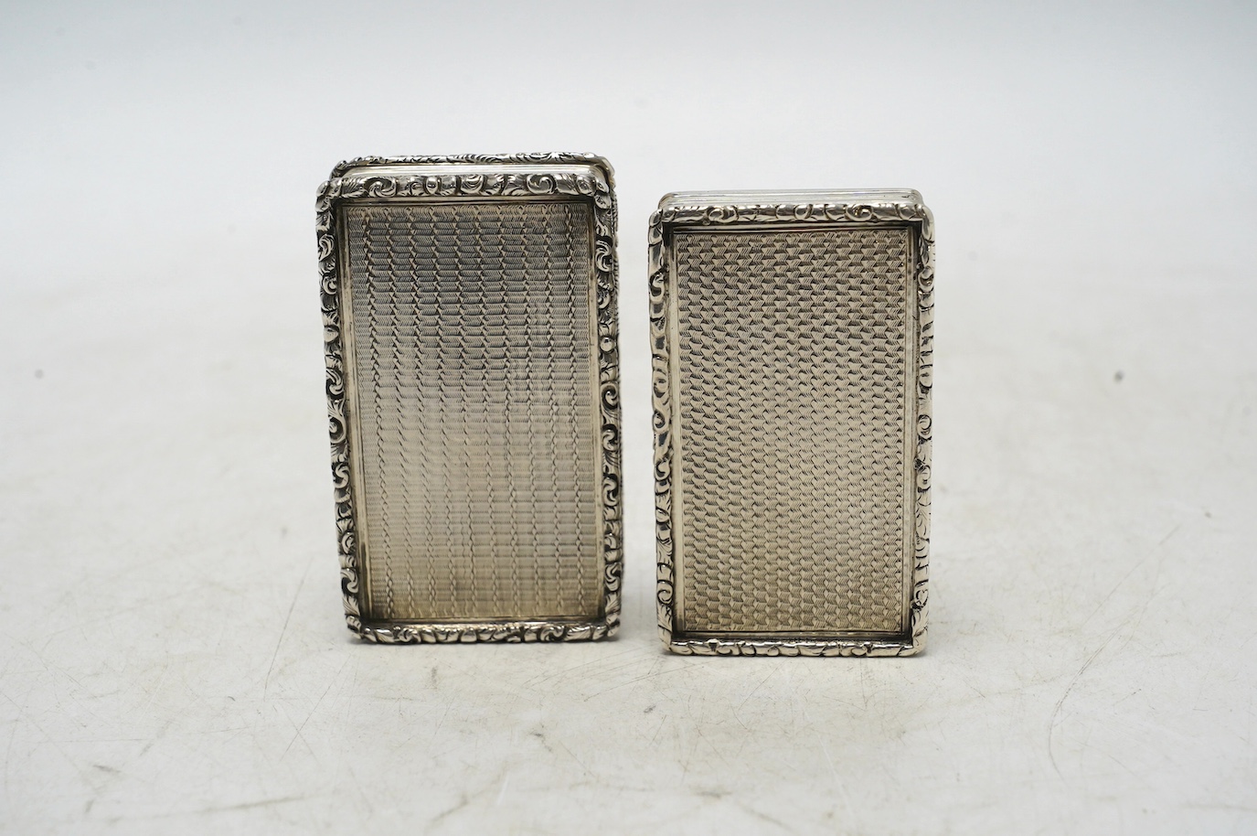 Two late William IV engine turned silver rectangular snuff boxes, Francis Clark, Birmingham, 1835/6, largest 70mm. Condition - fair